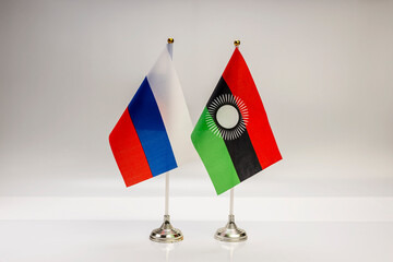 National flags of Russia and Malawi on a light background. State flags.