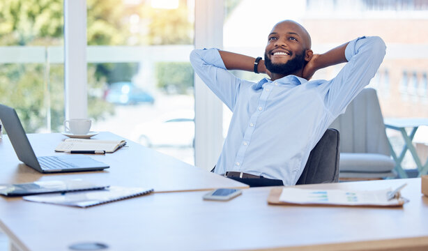 Stretching, relax and happy black man in office after finishing work project, planning or complete job in business. Peace of mind, calm and employee resting for freedom, dream and thinking of future
