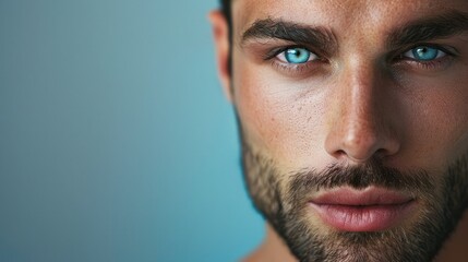 Fototapeta premium Close-up of a handsome man's face, highlighting his well-defined features. Ample copy space on the left side.