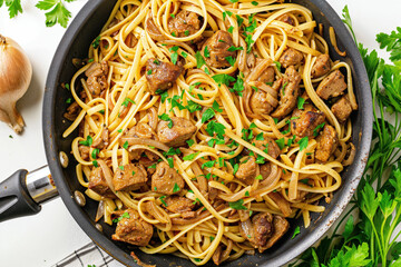 A pan filled with linguine pasta, cooked chicken liver, saut&eacute;ed onions, and garnished with fresh parsley