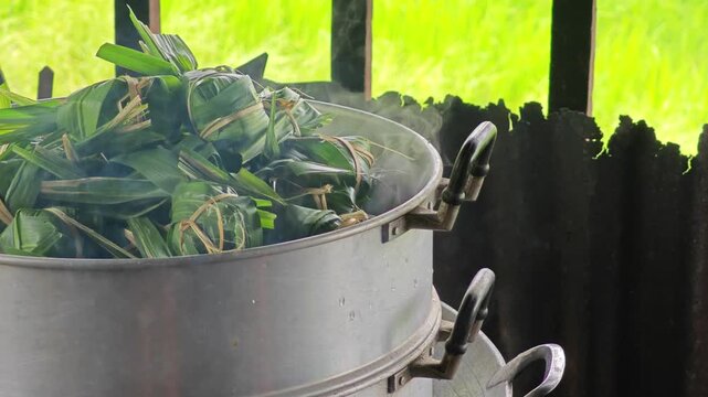 Thai dessert wrapped by pandanus leaves
