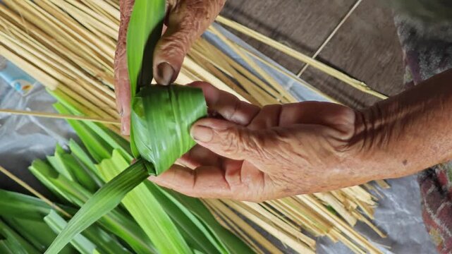 Sticky rice which is then wrapped in pandanus leaves.