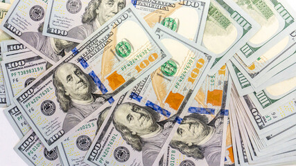 Close up view of cash dollar banknotes, 100 one hundred US dollar bills, 50 US dollar bills, 20 US dollar bills, lots of cash.