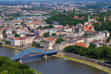 Pilsudski Bridge leading from Old town of Krakow through Vistula river to Podgorze district with St. Joseph's Church towering over it. View from observation viewing platform on tethered balloon  © Blumesser