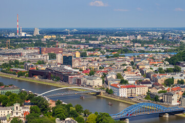 Bridges leading from Kazimierz through Vistula river to Podgorze district and PGE Power Station on the background. View from observation viewing platform on tethered balloon Balon Widokowy