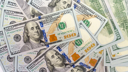 Close up view of cash dollar banknotes, 100 one hundred US dollar bills, 50 US dollar bills, 20 US dollar bills, lots of cash.