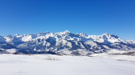 View of Snow-Covered Caucasus Mountains under Clear Blue Sky 