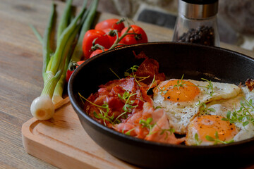 fried eggs on pan in kitchen