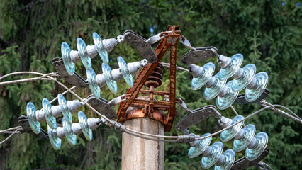An old telegraph pole with metal and glass components