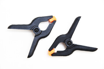 Obraz premium Plastic clothespins for fastening. Clamps for carpentry workshop.