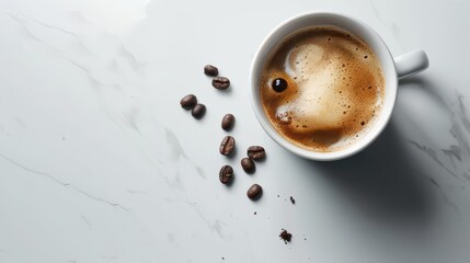 Cup of coffee with cream and coffee beans on marble background