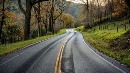 Fototapeta premium Beautifully paved road meandering through a scenic landscape, showcasing the beauty of the journey and the surrounding environment.