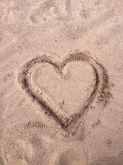 Heart in the sand B
Beach love symbol
Sand heart drawing
Romantic beach art
Heart on the shore
Beach heart shape
Love in the sand
Heart etched in sand
Seaside love symbol
Heart on the beach
Sand art