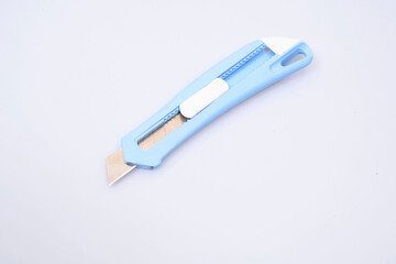 office knife on a white background