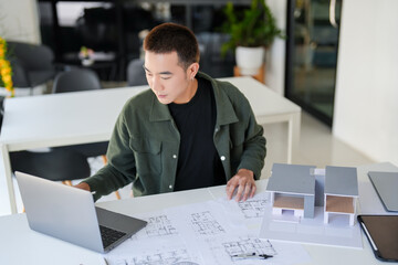 Architecture Man drawing on architectural Creative project business architecture building construction Industrial engineering Achievement Planning Design on eco blueprint