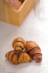 rogalach croissant with chocolate on white table menu shoot