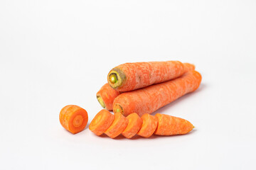 Front view and side view of fresh beautiful orange carrots with slices or pieces in a stack is isolated on white background with clipping path.