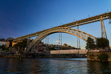 Douro river with famous Dom Luis I Bridge, Porto in Portugal.