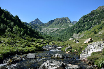 Valley of the mountain river Malaya Dukka in the mountains of the North Caucasus. Tourist trail to the lakes in the mountains of the Arkhyz resort, Karachay-Cherkessia, Russia © Oksana