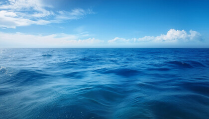 Obraz premium a beautiful blue sea with clouds. background, concept of calm and relaxation , high resolution