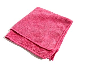 A single folded towel cloth fabric with pink color for bathing and showering isolated on white background