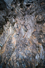 A beautifully textured rock surface set in a stunning natural environment or setting