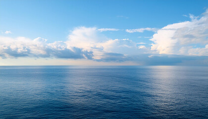 Fototapeta premium a beautiful blue sea with clouds. background, concept of calm and relaxation , high resolution