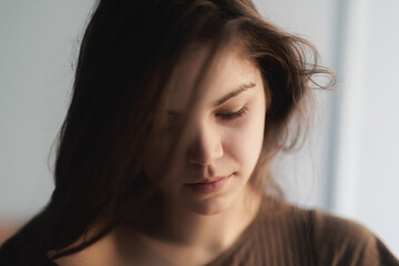 Thoughtful young woman with intense gaze