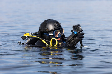 Canadian military scuba diver in water with camera