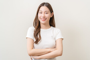 Obraz premium Smile positive, happy asian young woman, girl in casual, portrait of beautiful female with long hair feeling prond standing looking at camera, isolated on white background, copy space.