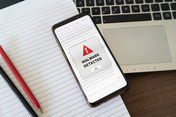 Malware alert notification appearing on the phone while in use. Antivirus concept in action.