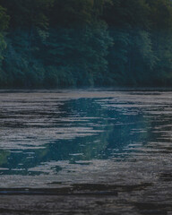 Water path in a dark lake at dusk, reflection