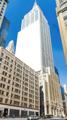 Tall skyscrapers gleam in sunlight beside an empty billboard in a bustling urban area