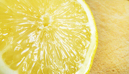 Half cut lemon close up look on inside on cut board