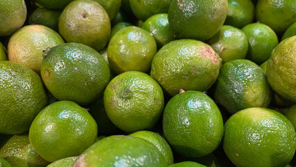 Fresh key limes .Lemon as texture background .Lemon one of main ingredient thai food