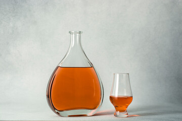 Close-up of a glass and bottle of whiskey.