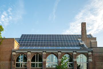Green renovation: solar cells on the roof of a renovated and renewed church building in the Toronto beaches room for text