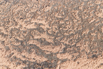 Abstract relief rough gritty neutral beige surface of background texture. Aesthetic pattern on sandstone. Top view textured sand, natural ornament or wallpaper, macro photo shore salt lake