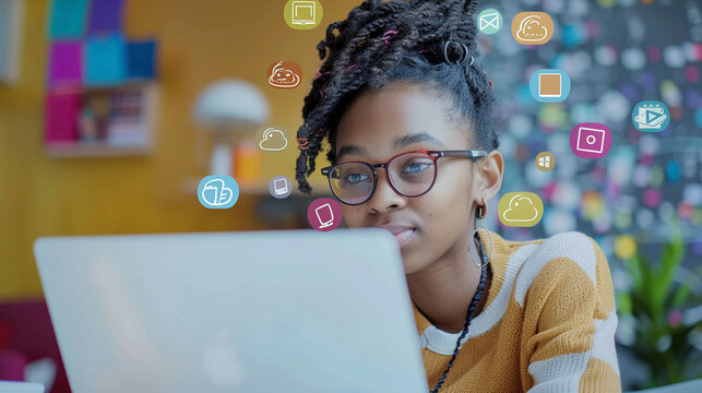 Student participating in online learning with a laptop and floating digital icons