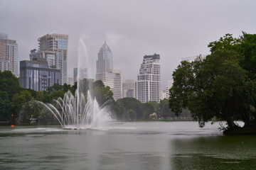 Fototapeta premium Lumphini Park on a rainy day in Bangkok, Thailand