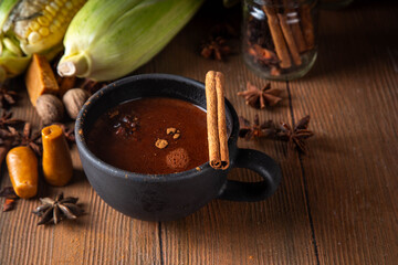 Mexican Champurrado, atole de cacao. Corn Chocolate hot spicy drink with cinnamon. Traditional Festive latin american Beverage, Dia de muertos, Cinco de Mayo, Christmas holiday food