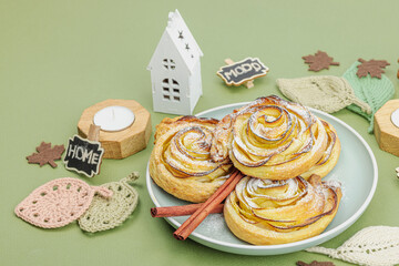 Apple roses pie with sugar powder. Traditional autumn baking, fall decor, flat lay