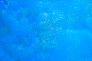A blue background with a few brush strokes