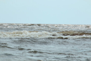 Large wave ridges with foam during a storm.