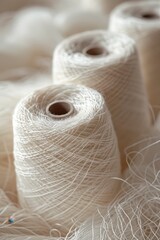 A pile of white yarn with a few different colors. The yarn is piled on top of each other and is in a variety of sizes