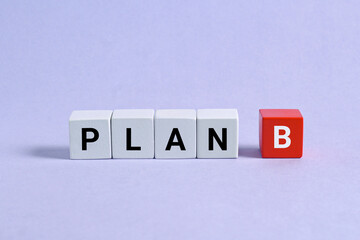 Plan b test on white red wooden cubes  on the blue background. business concept