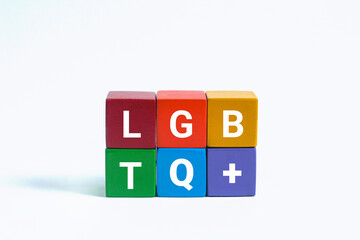 Lgbtq word  with colorful rainbow flag cubes on white background