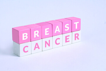 Breast cancer text written on Pink white cubes with white background