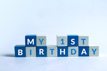 My first birthday text written on Blue white cubes with white background