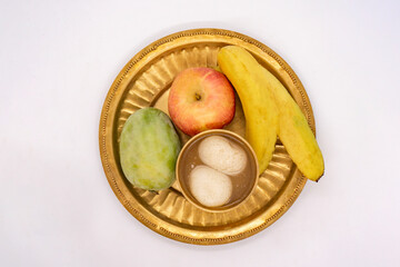 Puja Thali with Apple Banana Mango Fruits and Indian Sweets Rasbhari for Diwali Deepawali Tihar